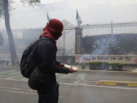 Colleagues of the 43 missing students from Ayotzinapa fire rockets on Monday, September 23, 2024, outside the Ministry of the Interior in Me...