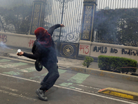 Colleagues of the 43 missing students from Ayotzinapa fire rockets on Monday, September 23, 2024, outside the Ministry of the Interior in Me...