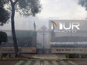 Colleagues of the 43 missing students from Ayotzinapa fire rockets on Monday, September 23, 2024, outside the Ministry of the Interior in Me...