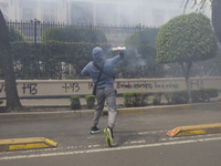 Colleagues of the 43 missing students from Ayotzinapa fire rockets on Monday, September 23, 2024, outside the Ministry of the Interior in Me...