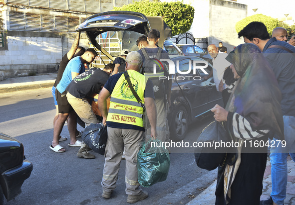 People who flee their villages in southern Lebanon are received at an art institute transformed into a shelter for persons displaced by conf...