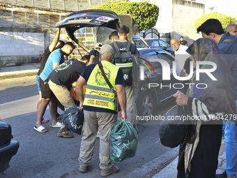 People who flee their villages in southern Lebanon are received at an art institute transformed into a shelter for persons displaced by conf...