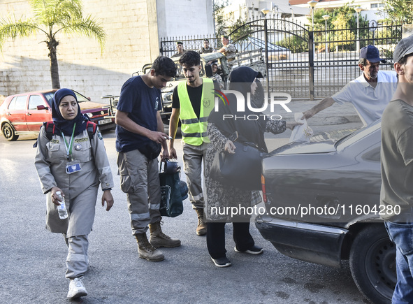 People who flee their villages in southern Lebanon are received at an art institute transformed into a shelter for persons displaced by conf...