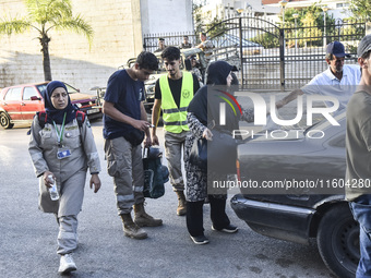 People who flee their villages in southern Lebanon are received at an art institute transformed into a shelter for persons displaced by conf...