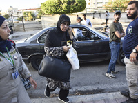 People who flee their villages in southern Lebanon are received at an art institute transformed into a shelter for persons displaced by conf...