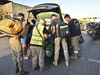 People who flee their villages in southern Lebanon are received at an art institute transformed into a shelter for persons displaced by conf...