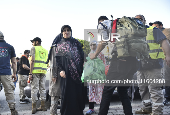 People who flee their villages in southern Lebanon are received at an art institute transformed into a shelter for persons displaced by conf...