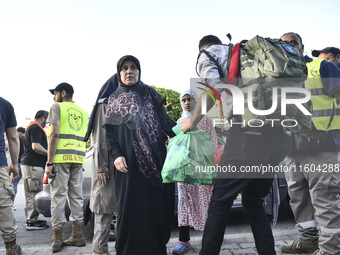 People who flee their villages in southern Lebanon are received at an art institute transformed into a shelter for persons displaced by conf...