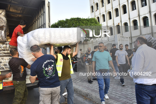 People who flee their villages in southern Lebanon are received at an art institute transformed into a shelter for persons displaced by conf...