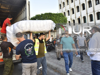 People who flee their villages in southern Lebanon are received at an art institute transformed into a shelter for persons displaced by conf...