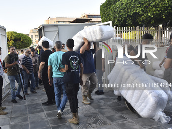 People who flee their villages in southern Lebanon are received at an art institute transformed into a shelter for persons displaced by conf...