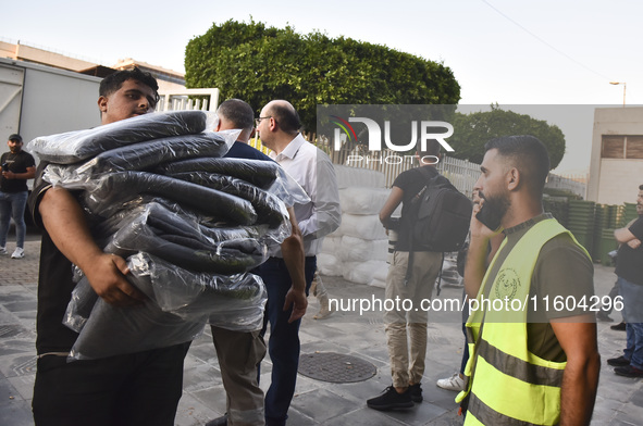 People who flee their villages in southern Lebanon are received at an art institute transformed into a shelter for persons displaced by conf...