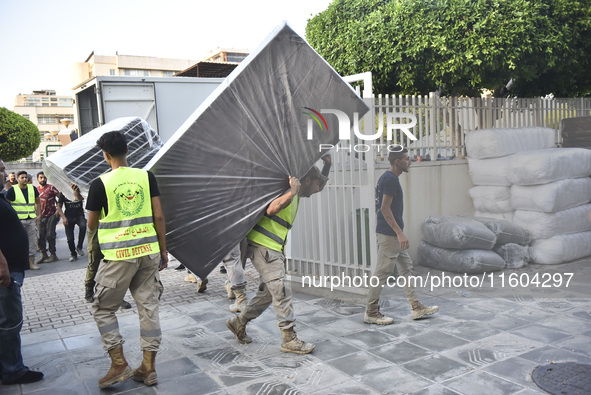 People who flee their villages in southern Lebanon are received at an art institute transformed into a shelter for persons displaced by conf...