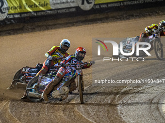 Belle Vue Aces' Jaimon Lidsey in red leads Leicester Lions' Sam Masters in white and Leicester Lions' Luke Becker in yellow during the Rowe...