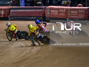 Leicester Lions' guest rider Lewis Kerr chases Leicester Lions' Ryan Douglas, Belle Vue Aces' Jake Mulford in blue, and Belle Vue Aces' Dan...