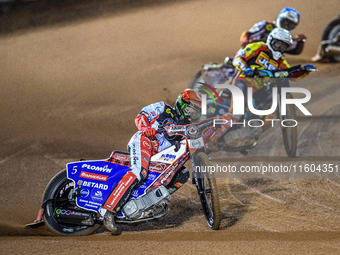 Dan Bewley of Belle Vue Aces in red leads Ryan Douglas of Leicester Lions in white and Jake Mulford of Belle Vue Aces in blue during the Row...