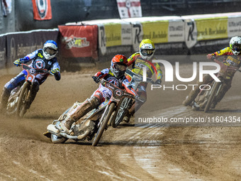 Belle Vue Aces' Jaimon Lidsey in red leads Belle Vue Aces' guest rider Niels K. Iversen in blue, Leicester Lions' Max Fricke in white, and L...