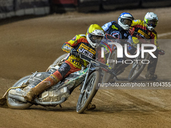 Leicester Lions' Richard Lawson in yellow leads Belle Vue Aces' guest rider Niels K. Iversen in blue and Leicester Lions' Max Fricke in whit...