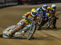 Leicester Lions' Richard Lawson in yellow leads Belle Vue Aces' guest rider Niels K. Iversen in blue and Leicester Lions' Max Fricke in whit...