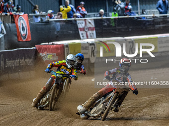 Belle Vue Aces' Brady Kurtz in red leads Leicester Lions' Ryan Douglas in white and Belle Vue Aces' Norick Blodorn in blue during the Rowe M...