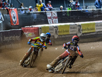 Belle Vue Aces' Brady Kurtz in red leads Leicester Lions' Ryan Douglas in white and Belle Vue Aces' Norick Blodorn in blue during the Rowe M...