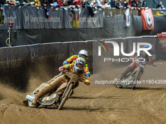 Ryan Douglas of Leicester Lions in white leads guest rider Lewis Kerr of Leicester Lions in yellow and Norick Blodorn of Belle Vue Aces in b...