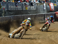 Ryan Douglas of Leicester Lions in white leads guest rider Lewis Kerr of Leicester Lions in yellow and Norick Blodorn of Belle Vue Aces in b...