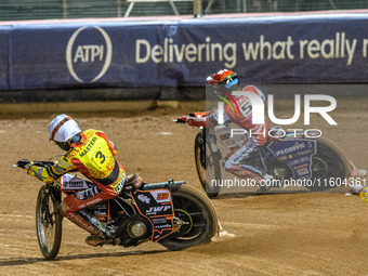 Belle Vue Aces' Dan Bewley in red passes Leicester Lions' Sam Masters in white during the Rowe Motor Oil Premiership Grand Final 1st Leg bet...