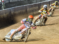 Belle Vue Aces' Dan Bewley in red leads Leicester Lions' Sam Masters in white and Leicester Lions' Luke Becker in yellow during the Rowe Mot...