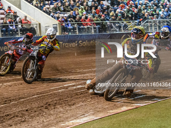 Leicester Lions' Sam Hagon in yellow leads Leicester Lions' Richard Lawson in white, Belle Vue Aces' Norick Blodorn in red, and Belle Vue Ac...