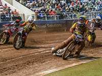 Leicester Lions' Sam Hagon in yellow leads Leicester Lions' Richard Lawson in white, Belle Vue Aces' Norick Blodorn in red, and Belle Vue Ac...