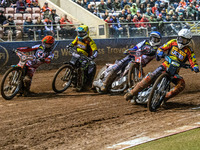 Leicester Lions' Ryan Douglas in white leads Belle Vue Aces' guest rider Niels K. Iversen in blue, Leicester Lions' guest rider Lewis Kerr i...