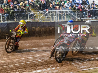 Dan Bewley of Belle Vue Aces in red leads Max Fricke of Leicester Lions in white, Antti Vuolas of Belle Vue Aces in blue, and Richard Lawson...