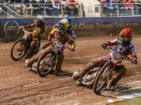 Belle Vue Aces' Jaimon Lidsey in red rides inside Leicester Lions' Sam Hagon in yellow, Belle Vue Aces' Jake Mulford in blue, and Leicester...