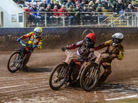 Leicester Lions' Max Fricke in white and Belle Vue Aces' Brady Kurtz in red get close with Leicester Lions' Ryan Douglas in yellow behind du...