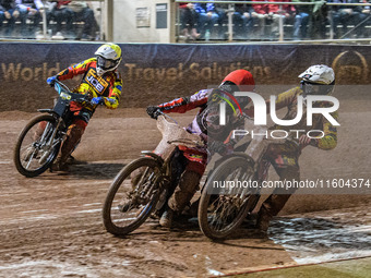 Leicester Lions' Max Fricke in white and Belle Vue Aces' Brady Kurtz in red get close with Leicester Lions' Ryan Douglas in yellow behind du...