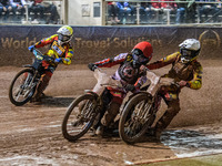 Leicester Lions' Max Fricke in white and Belle Vue Aces' Brady Kurtz in red get close with Leicester Lions' Ryan Douglas in yellow behind du...