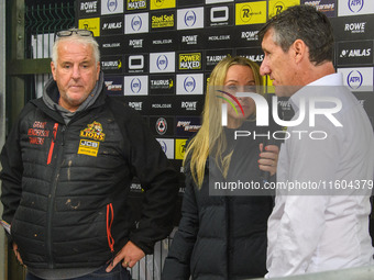 Eurosport presenter Abi Stephens (center) interviews Belle Vue Aces' Team Manager Mark Lemon (right) with Leicester Lions' Team Manager Stua...