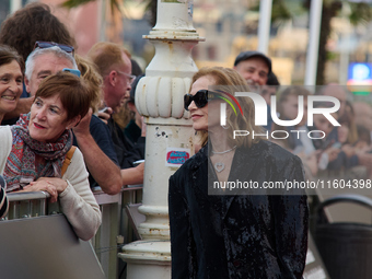 Isabelle Huppert attends the red carpet of the film Yeohaengjaui Pilyo during the 72nd San Sebastian International Film Festival in San Seba...