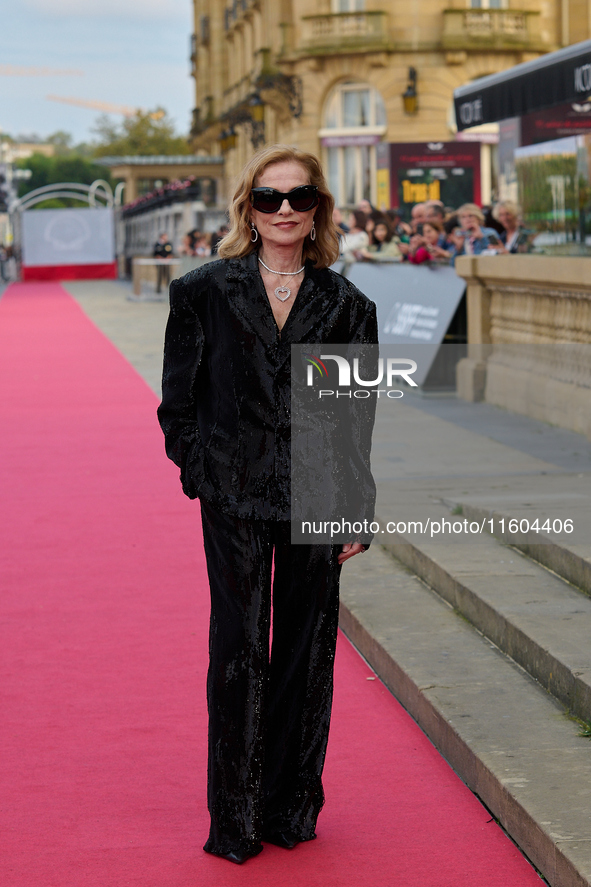 Isabelle Huppert attends the red carpet of the film Yeohaengjaui Pilyo during the 72nd San Sebastian International Film Festival in San Seba...