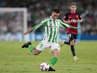 Chimy Avila of Real Betis makes a center to the area during the La Liga EA Sports match between Real Betis and RCD Mallorca at Benito Villam...