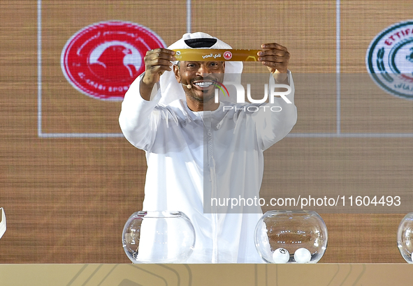 A member of the organizing committee shows the name of Al Arabi SC of Qatar during the 2024-25 Gulf Club Champions League draw ceremony in D...