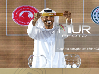 A member of the organizing committee shows the name of Al Arabi SC of Qatar during the 2024-25 Gulf Club Champions League draw ceremony in D...