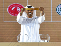 A member of the organizing committee shows the name of Al Arabi SC of Qatar during the 2024-25 Gulf Club Champions League draw ceremony in D...