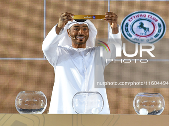 A member of the organizing committee shows the name of Al Nasr of the United Arab Emirates during the 2024-25 Gulf Club Champions League dra...