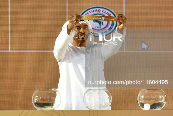 A member of the organizing committee shows the name of Al Ettifaq FC of Saudi Arabia during the 2024-25 Gulf Club Champions League draw cere...