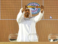 A member of the organizing committee shows the name of Al Ettifaq FC of Saudi Arabia during the 2024-25 Gulf Club Champions League draw cere...