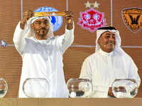 A member of the organizing committee shows the name of Al-Riffa of Bahrain during the 2024-25 Gulf Club Champions League draw ceremony in Do...