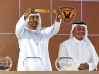 A member of the organizing committee shows the name of Al-Qadisiyah of Kuwait during the 2024-25 Gulf Club Champions League draw ceremony in...