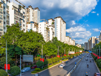 National flags fly along the Golden Buddha Avenue to celebrate the upcoming National Day in Chongqing, China, on September 24, 2024. (